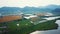 Lake Biwako meets farmlands growing rice aerial