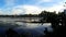 Lake boatman paddle his row boat across the lake