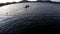 Lake boatman paddle his row boat across the lake. silhouettes