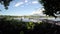 Lake boatman paddles his tiny wooden boat across mountain lake