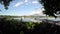 Lake boatman paddles his tiny wooden boat across mountain lake