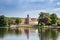 Lake and Castle of Eutin between Trees in Summer, Germany