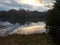 Lake clouds trees double image