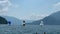 Lake Como, Bellano, Italy: Sailboats sailing on a sunny summer day