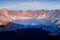 Lake in the crater of a volcano at sunset. Reflection of  water. Indonesia. Rinjani volcano.