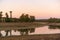 Lake Embalse de Piedra Aguda dam near Olivenza, Spain at sunset with beautiful reflection on the water