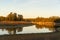 Lake Embalse de Piedra Aguda dam near Olivenza, Spain at sunset with beautiful reflection on the water