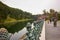 The lake at the Emperor Garden Tourist gather for photos by the moat and Cherry Blossom tree at the Imperial Palace Gardens