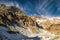 Lake Fiorenza covered with ice on the slopes of Monviso