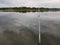 Lake Fishing off the dock early summer late day cloudy raining walleye