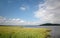 Lake, flood plain and skies