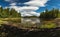 Lake Foldsjoen shores in summer time, Norway. Beautiful boreal forest lake