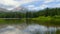 Lake Forest and Mountain Peak with People in Kayaks