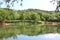 Lake in the forest, recreation area with boats and wooden gazebos and bridges