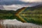 Lake and forest in Rotorua volcanic area with double rainbow, Ne