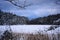 A lake in a forest during winter in Scandinavia