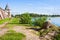 Lake, fortress tower and wall of Kirillo-Belozersky monastery near City Kirillov, Vologda region, Russia