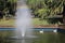 The lake and fountain, rainbow and white swans