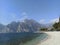 Lake Garda, beach and wonderful mountains in Trentino Alto Adige Italy at Riva del Garda