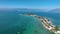 LAKE GARDA, ITALY - APRIL, 2023: Aerial view of a coastline of Lake Garda. drone shot of lake near city and mountains