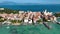 LAKE GARDA, ITALY - APRIL, 2023: Aerial view of a coastline of Lake Garda. drone shot of lake near city and mountains