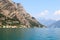 Lake Garda and mountain panorama with boat in Limone
