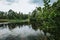 Lake in the green forest on the Skie Island with the clouds in the sky