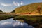 Lake among the hilly forested mountains. USA. Maine. Acadia National Park.