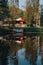 Lake house, beautiful pond next to the house, swimming ducks, green trees, water, stock photo