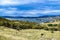 Lake Jindabyne landscape with overcast sky and rural foreground