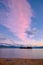 Lake Jindabyne sunrise and trail of glowing pink cloud, Australia