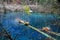 Lake at Jiuzhaigou with colorful tress and blue water