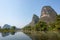 Lake with limestone karst hills foggy landscape in Yangshuo