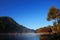 Lake, little houseboat and pine forest