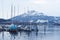 Lake lucerne in switzerland, yachts are moored against the background of snow-capped mountains, the concept of a winter mooring of