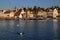 Lake Lucerne waterfront with historic buildings and swans in the foreground in the city of Lucerne, Switzerland