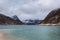 Lake with majestic mountains reflected in the still water of the shoreline