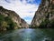 Lake in the Matka canyon - Macedonia. Mountains, emerald water, motor boats.