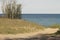 Lake michigan dunes entrance to water on sunny spring morning wi