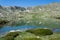 Lake mirroring mountains in Spain Pyrenees