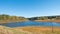 Lake `Mittlerer Pfauenteich` in the Harz mountains, Germany, with low water level because of a dry summer