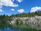 Lake Montferrand with emerald water and pleasure catamarans in the Ruskeala Mountain Park on a sunny summer day