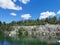 Lake Montferrand with emerald water and pleasure catamarans in the Ruskeala Mountain Park on a sunny summer day