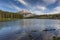 Lake with Mountains and Boreal Forest in Background - Alberta, C