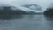 Lake Between Mountains Covered By Fog