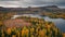 Lake and mountains with trees in autumn along the scenic Wilderness Road in Jämtland in Sweden from above