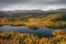 Lake and mountains with trees in autumn along the scenic Wilderness Road in Jämtland in Sweden from above