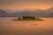 Lake Mutanda at sunset with view on the volcanoes mount Muhavuru and mount Gahinga in East Africa, along the border of Rwanda and