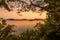 Lake Mutanda at sunset with view on the volcanoes mount Muhavuru and mount Gahinga in East Africa, along the border of Rwanda and