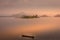 Lake Mutanda at sunset with view on the volcanoes mount Muhavuru and mount Gahinga in East Africa, along the border of Rwanda and